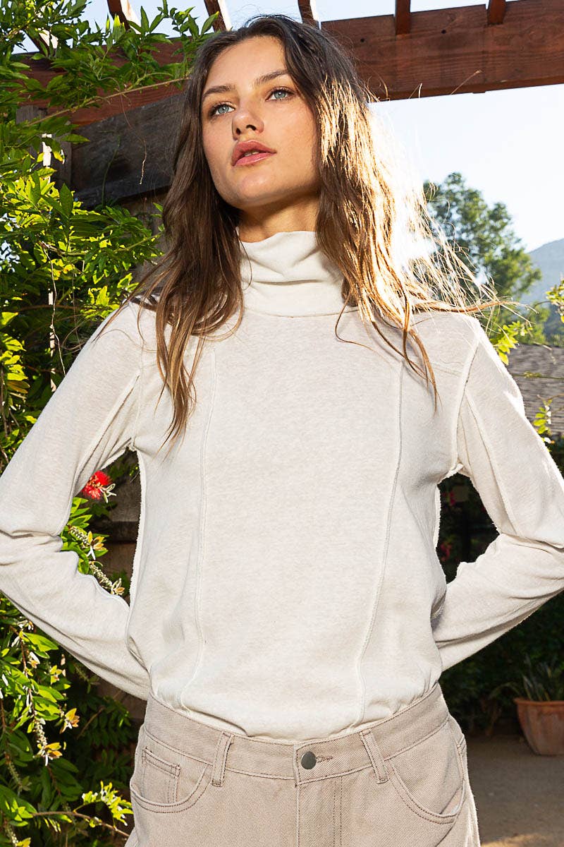 Mock Neck Exposed Seam Knit Top