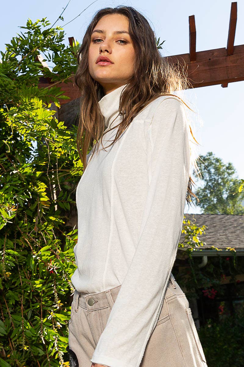 Mock Neck Exposed Seam Knit Top