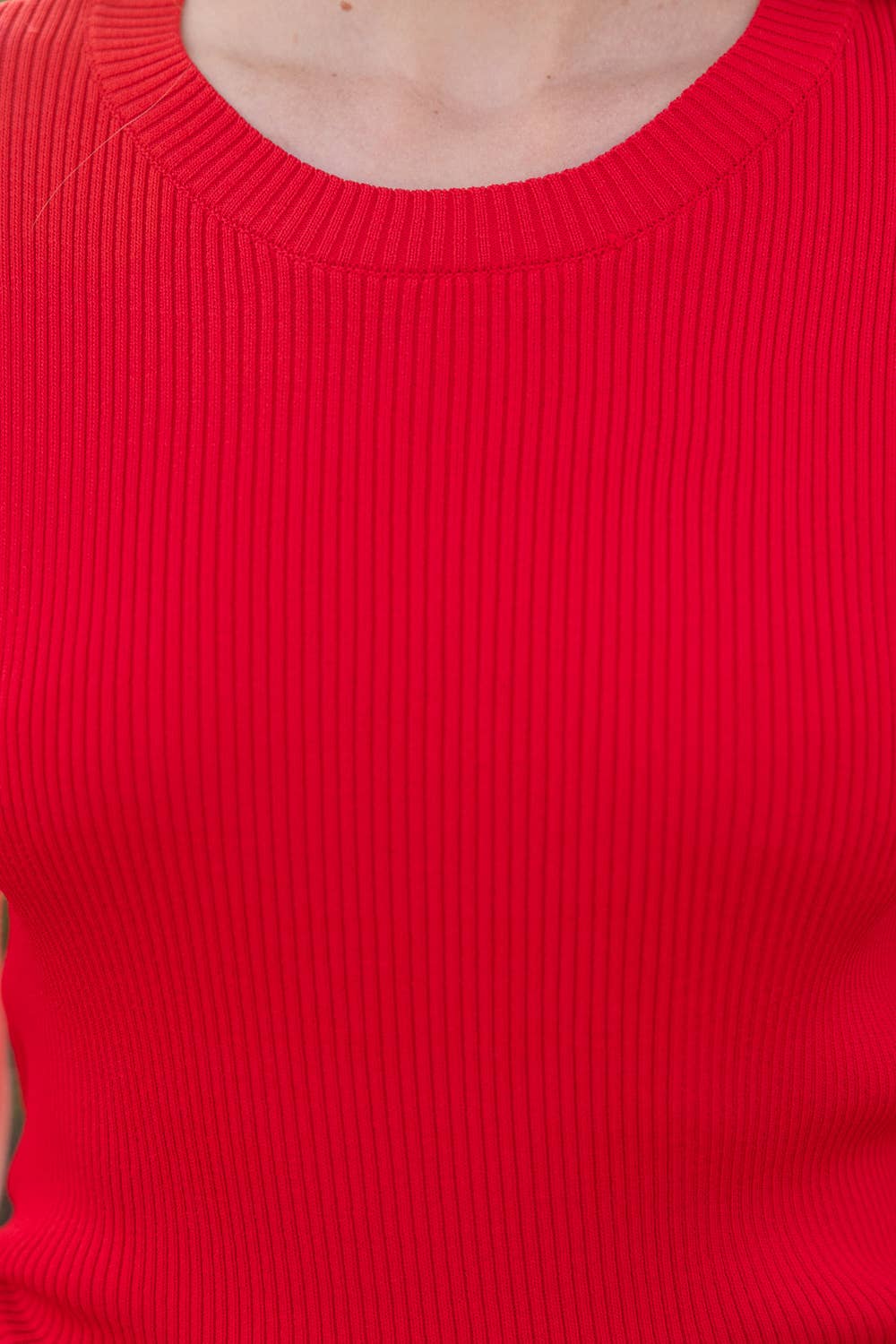 Close-up of a red ribbed sweater