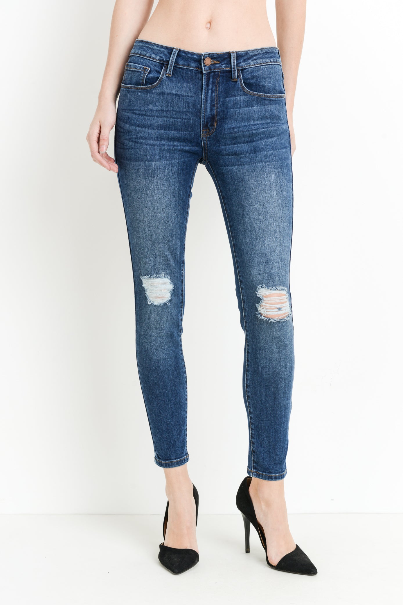 Mid rise dark denim skinny jeans with distressing